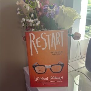 Scholastic Orange 'Restart' Book with Glasses Illustration by Gordon Korman